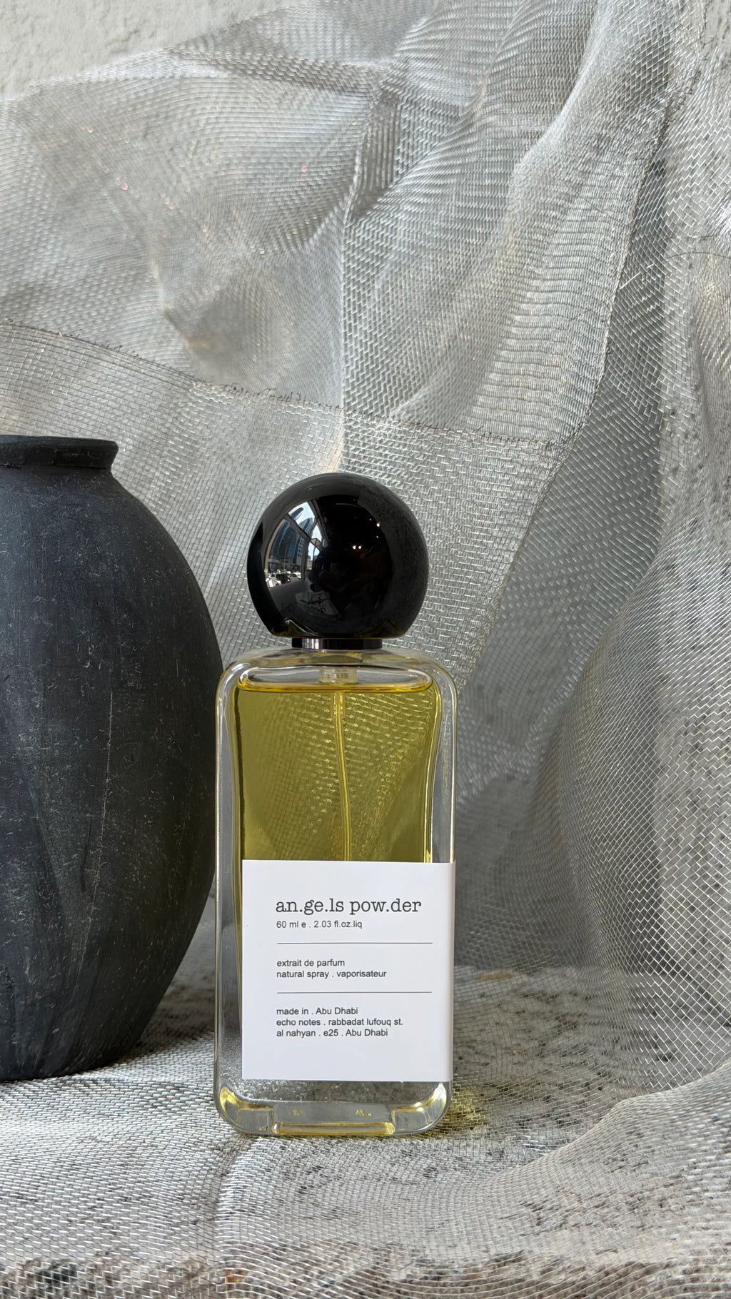 Angels' Powder eau de parfum bottle. Echo Notes oriental vanilla fragrance