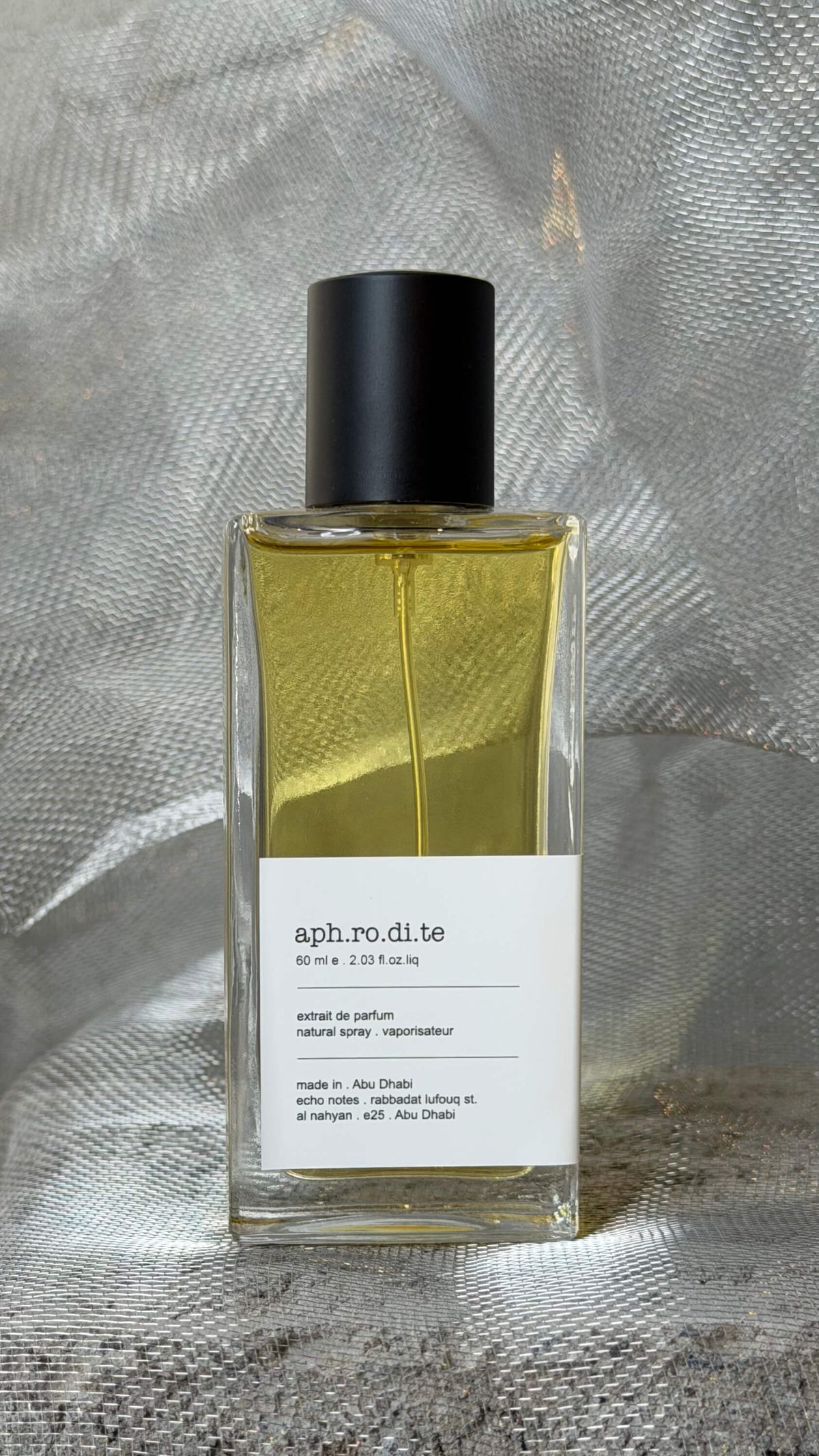 Aphrodite eau de parfum bottle Echo Notes leather oriental fragrance