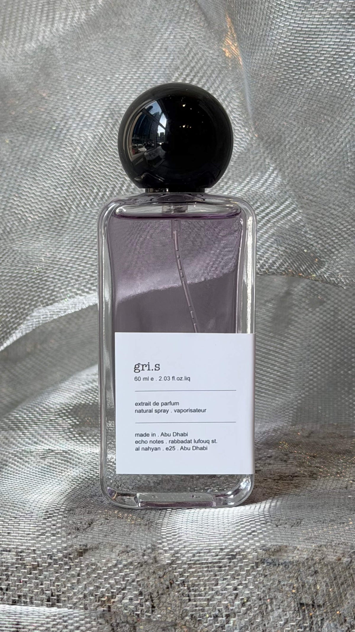 Gris eau de parfum bottle Echo Notes floral woody fragrance