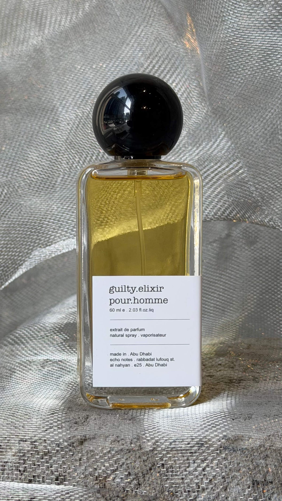 Guilty Elixir pour Homme eau de parfum bottle Echo Notes oriental woody fragrance