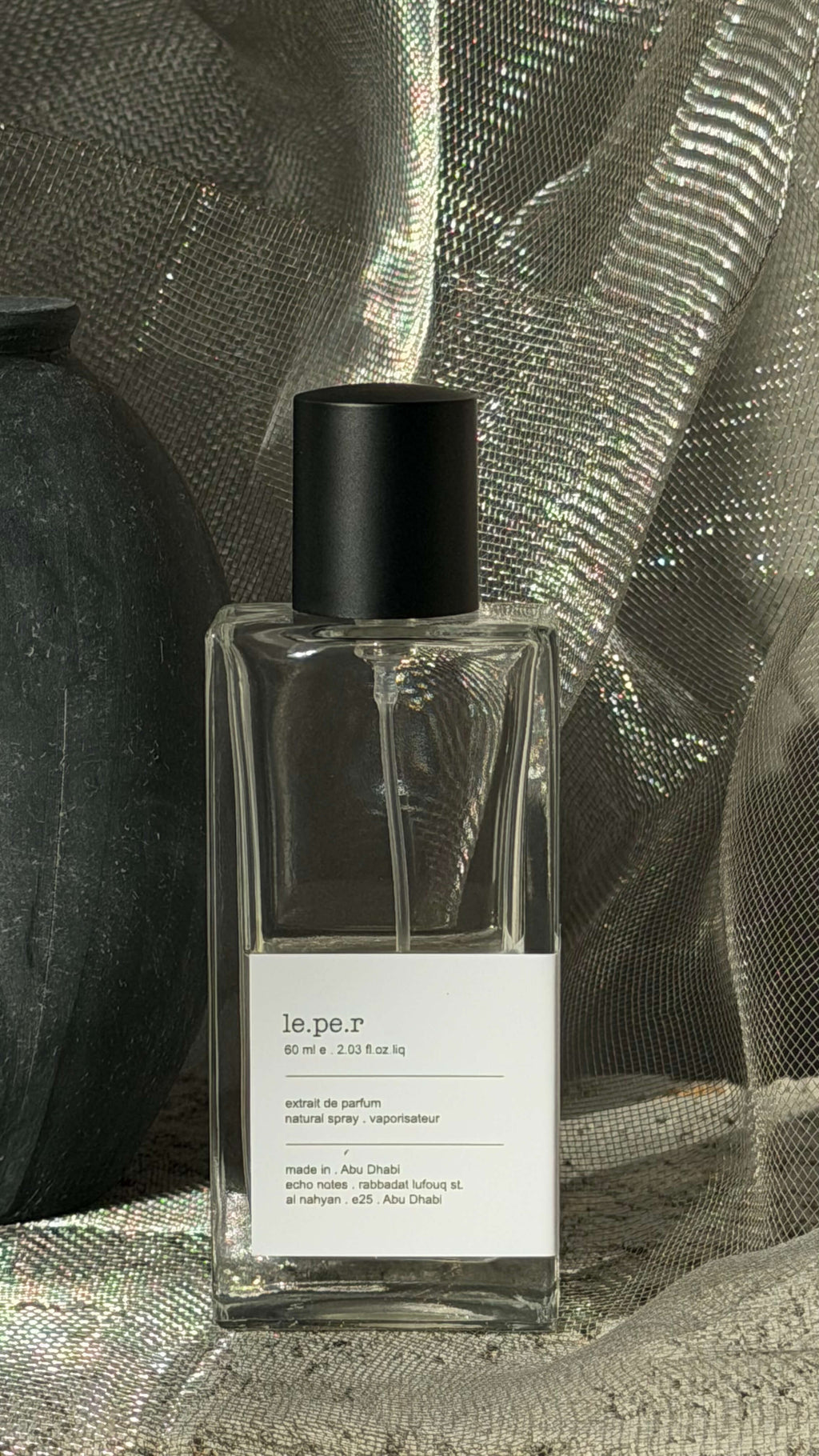 Leper eau de parfum bottle Echo Notes spicy woody fragrance