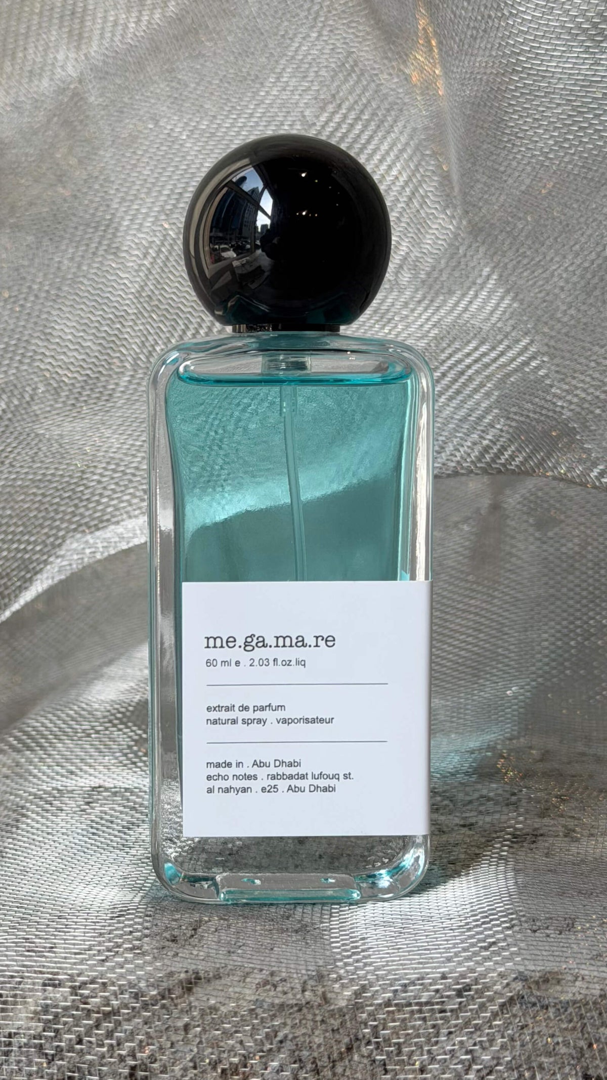 Megamare eau de parfum bottle Echo Notes aromatic aquatic fragrance