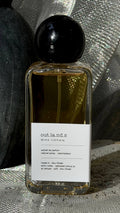Outlands eau de parfum bottle — Echo Notes oriental woody fragrance