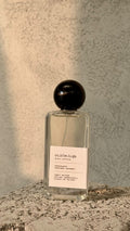 Echo Notes Cuir Béluga perfume bottle highlighted with accents of creamy vanilla, soft suede leather, and warm amber.