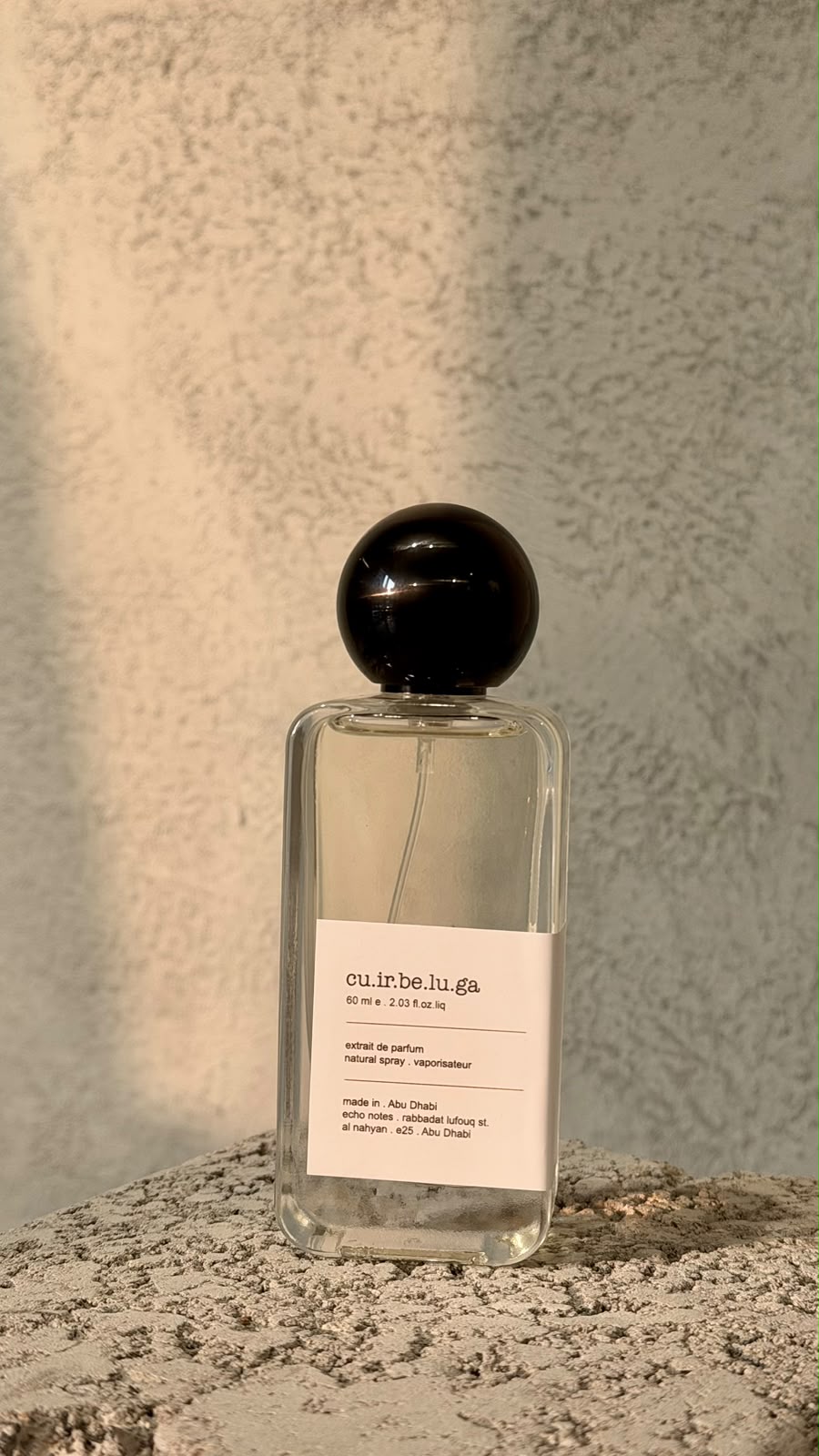Echo Notes Cuir Béluga perfume bottle highlighted with accents of creamy vanilla, soft suede leather, and warm amber.