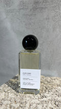 Echo Notes Epic Man perfume bottle surrounded by pink peppercorns, saffron threads, olibanum tears, and dark leather.