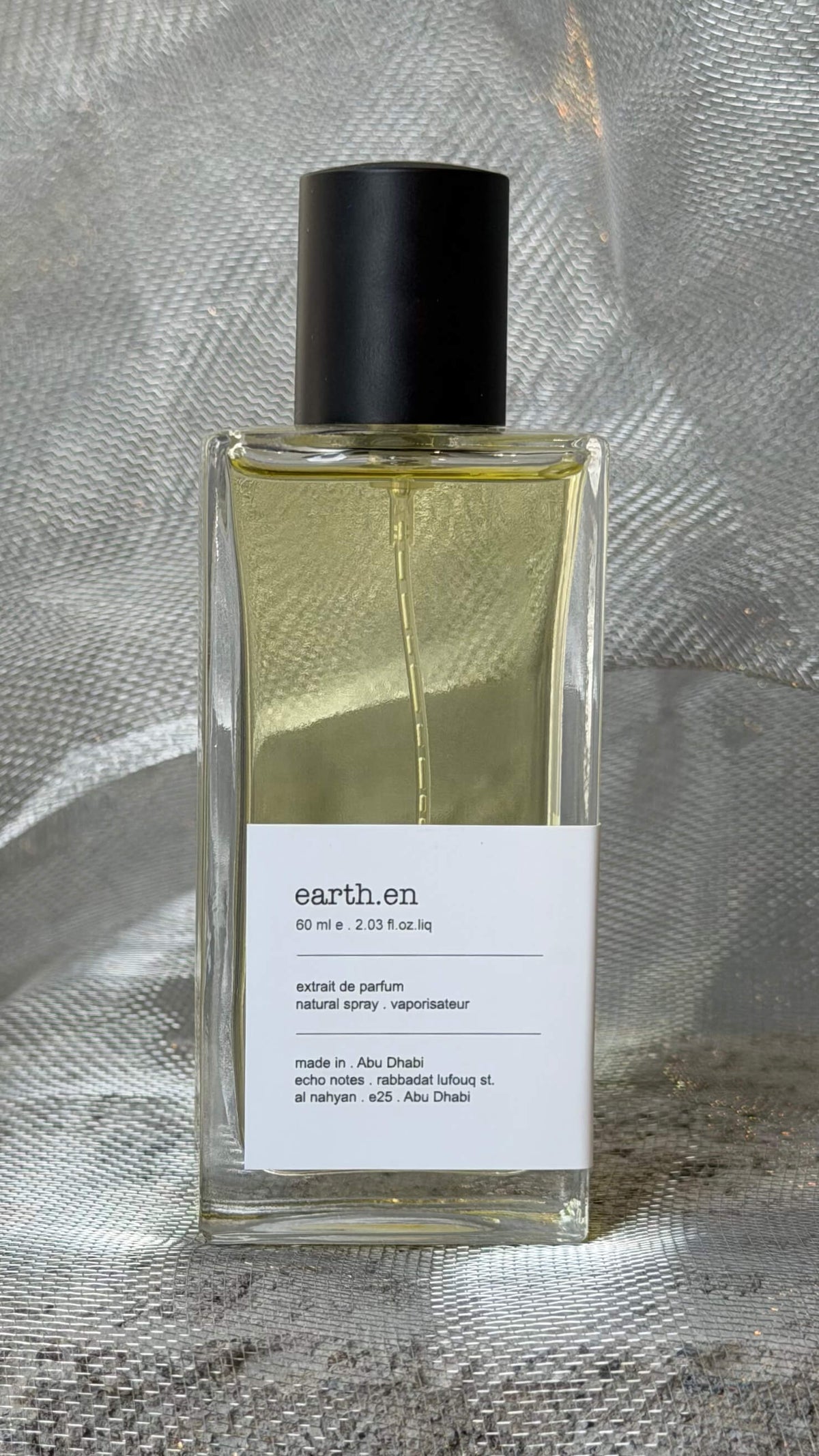 Earthen eau de parfum bottle Echo Notes spicy aromatic fragrance